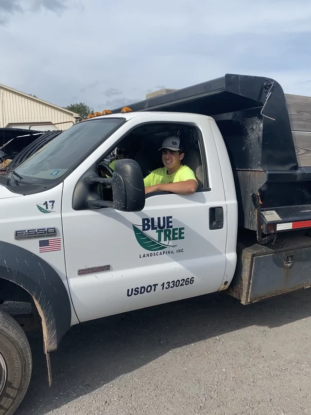A Blue Tree Outdoor Living truck.