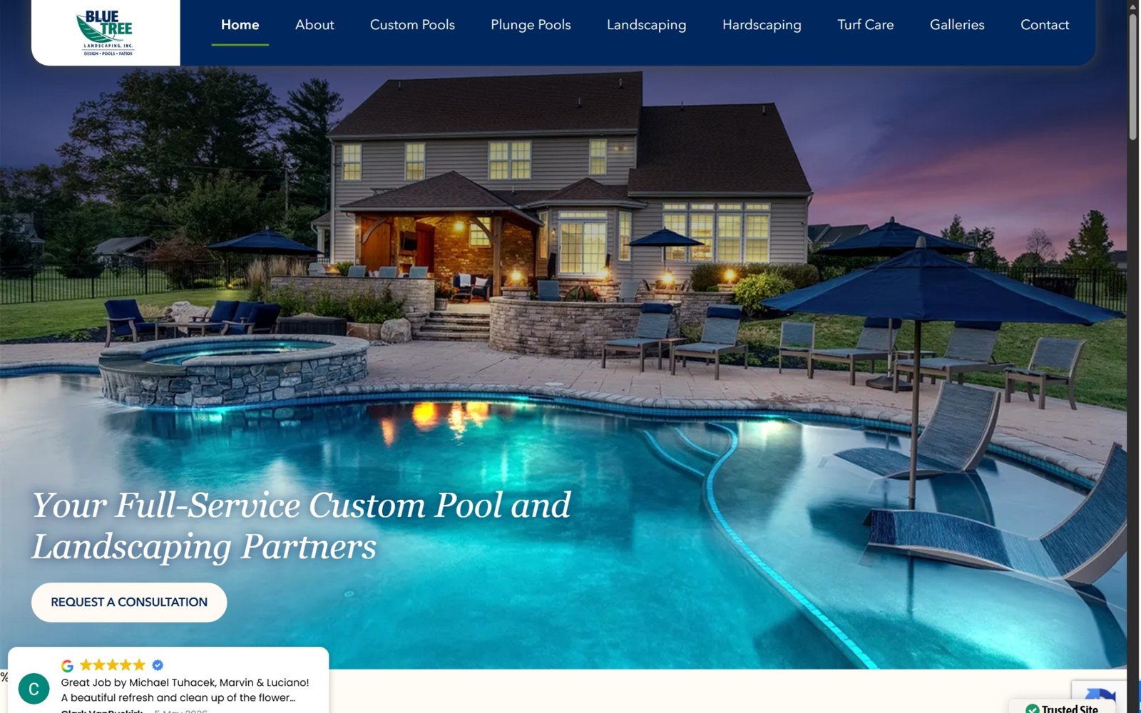 Blue Tree's old website: a dark blue nav over a pool-at-dusk hero photo with the headline Your Full-Service Custom Pool and Landscaping Partners