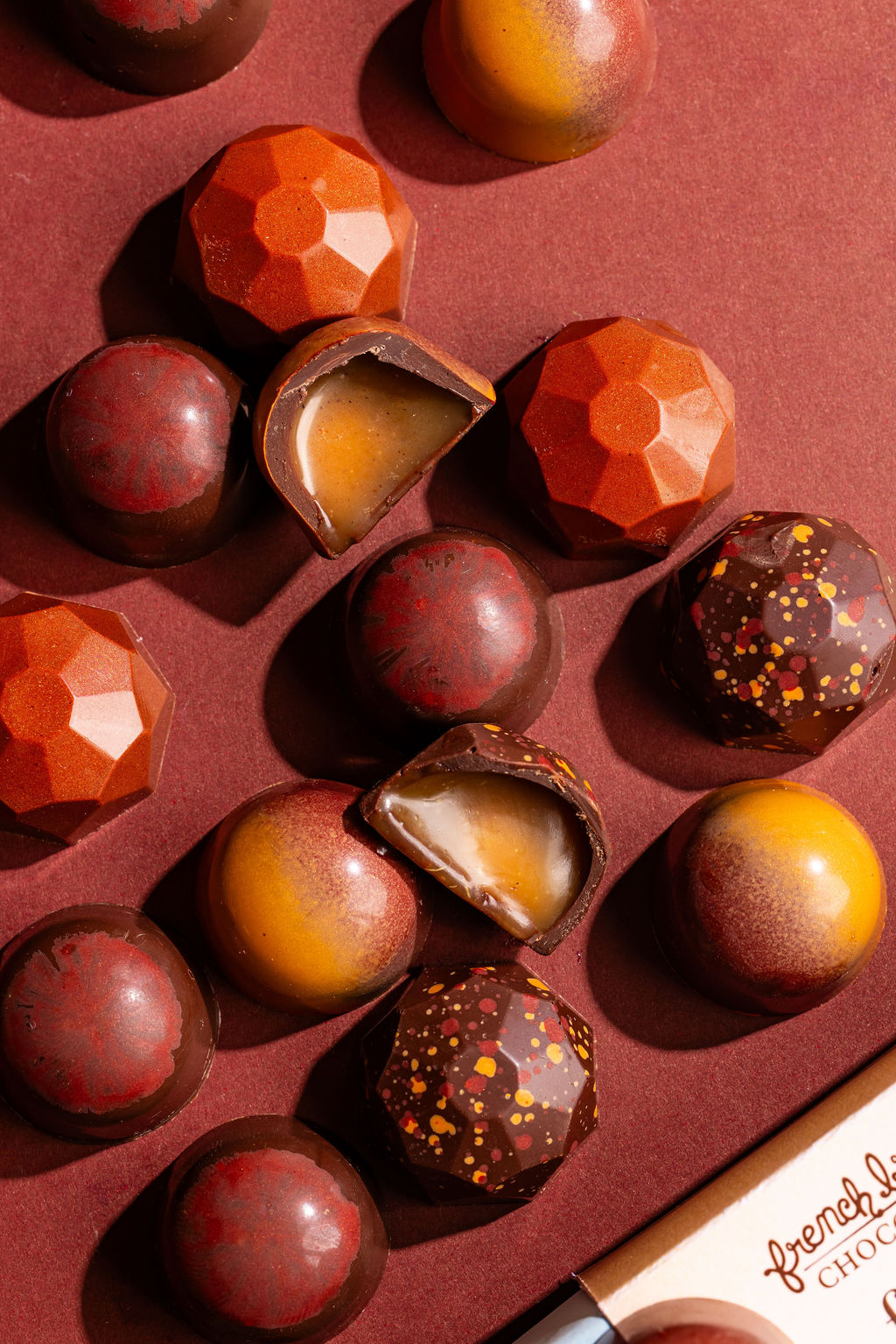 Cut-open bonbons showing soft caramel centers among the Fall Caramels
